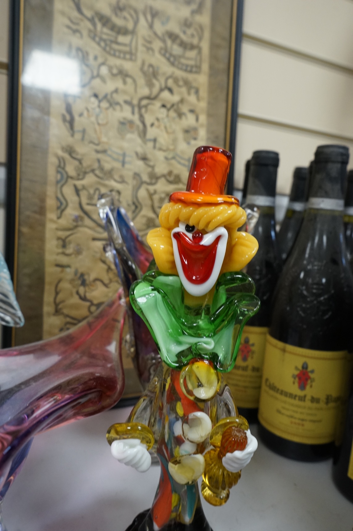 Two multi-coloured Murano glass clowns, a pair of 'fish' vases and modernist glassware, tallest 32cm